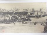 a black and white photo of a horse and buggy