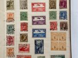 an open book with a lot of different stamps on it
