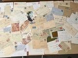 a box full of old letters and stamps on the floor