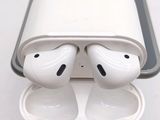 two airpods that are sitting in a case