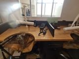 a desk with a sink and a laptop on it