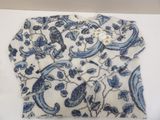 blue and white paisley print shirt with a button on the collar