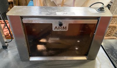 a small oven sitting on a table in a room