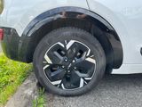a close up of a car tire on the side of the road