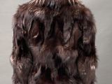 the back of a woman ' s jacket with fur on a mannequin mannequin