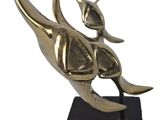 brass sculpture of a bird on a black base