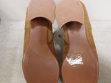 pair of women ' s shoes on a white surface with a white background