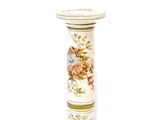 a picture of a tall vase with flowers on it