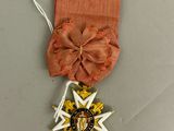 une image représentant une médaille ornée d'un ruban et d'une étoile