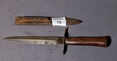 two knives that are sitting next to each other on a table