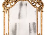 an image of a mirror with a gold frame on a white background
