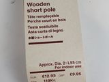 a small wooden object on the table with a price tag attached to it