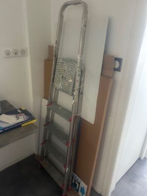 a ladder leaning against a wall in a room
