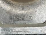 a close up of a metal object with a name on it