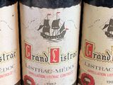 three bottles of wine sitting on top of a table next to each other