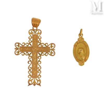 a close up of a cross and a medal on a white background