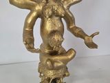 brass statue of a woman holding a child on her arm