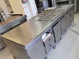 a large stainless steel counter in a commercial kitchen