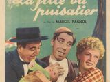 une vieille affiche de cinéma représentant un homme tenant un bébé dans ses bras