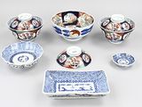 many different types of blue and white dishes and bowls