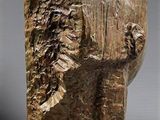 a close up of a sculpture of a head on a table