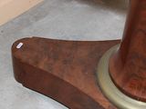 a close up of a wooden table with a clock on it