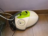 a vacuum that is sitting on the floor next to a trash can