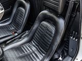 a picture of the interior of a car with black leather seats