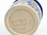 a close up of a blue and white vase with writing on it