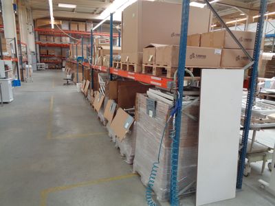 a large warehouse with a lot of boxes and boxes on the shelves