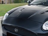 a black sports car parked on the side of the road