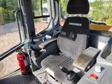 a picture of a seat in the back of a construction vehicle