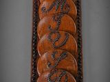 an image of a wooden plaque that has a bunch of coins on it