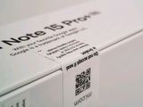 a white box with a qr code on it