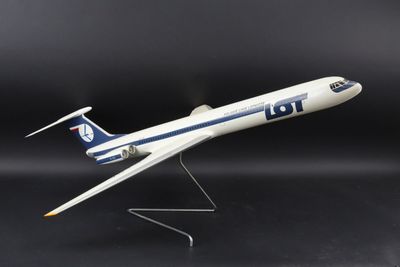 the model airplane is white and blue on a black background