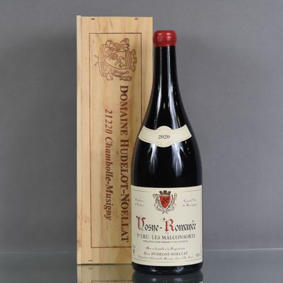 an old bottle of wine sitting next to a wooden box
