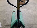 an image of a fork lifter in a garage
