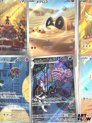 several pokemon cards are displayed on a table in a room