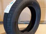 tire on the floor in a room with cardboard walls and cardboard flooring