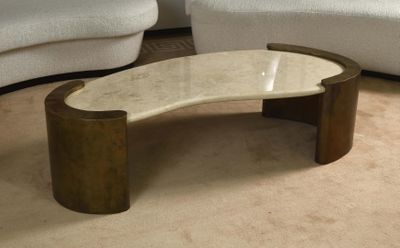 a coffee table with a marble top in a living room