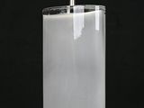 a close up of a glass bottle with a light bulb on top