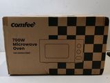 an open box of microwave oven sitting on top of a counter