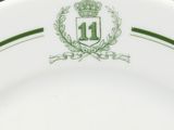 a close up of a plate with a crest on it