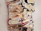 many pairs of shoes that are on a table