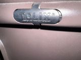 a close up of a car ' s emblem on the door handle