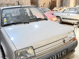 a car that is parked in a garage next to other cars