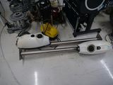 a vacuum that is sitting on the floor in a room