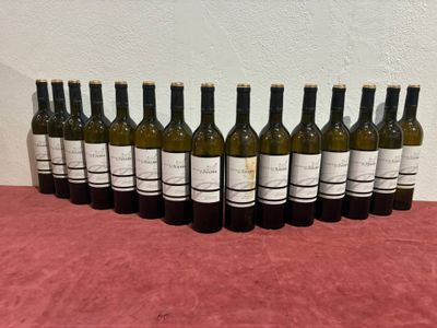 several bottles of wine are lined up on a table