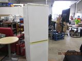 a refrigerator that is sitting in the middle of a room