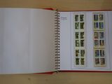 an open book with stamps on it sitting on a table